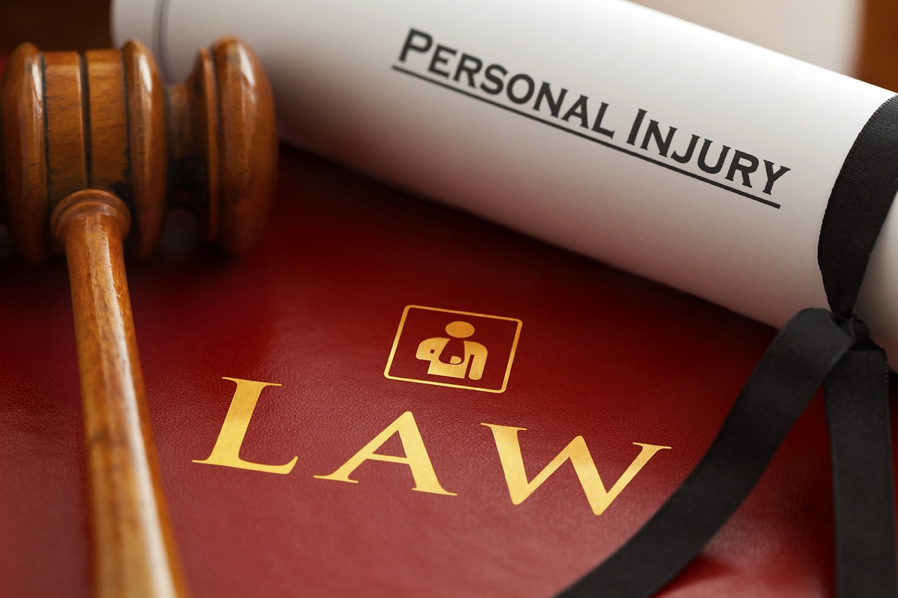 Personal Injury Law Letter Near Gavel and a Book Titled 'Law'
